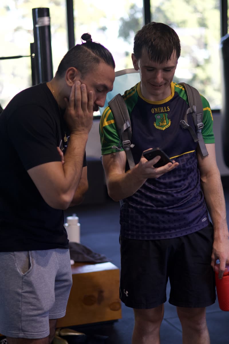 A Pad Flow coach and new member choosing a session time together